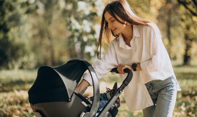 Young Mother Walking With Baby Stroller 1303 25360